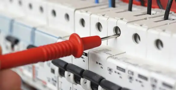 Electrical contractor testing circuit breakers during electrical repair in Elizabeth, NJ